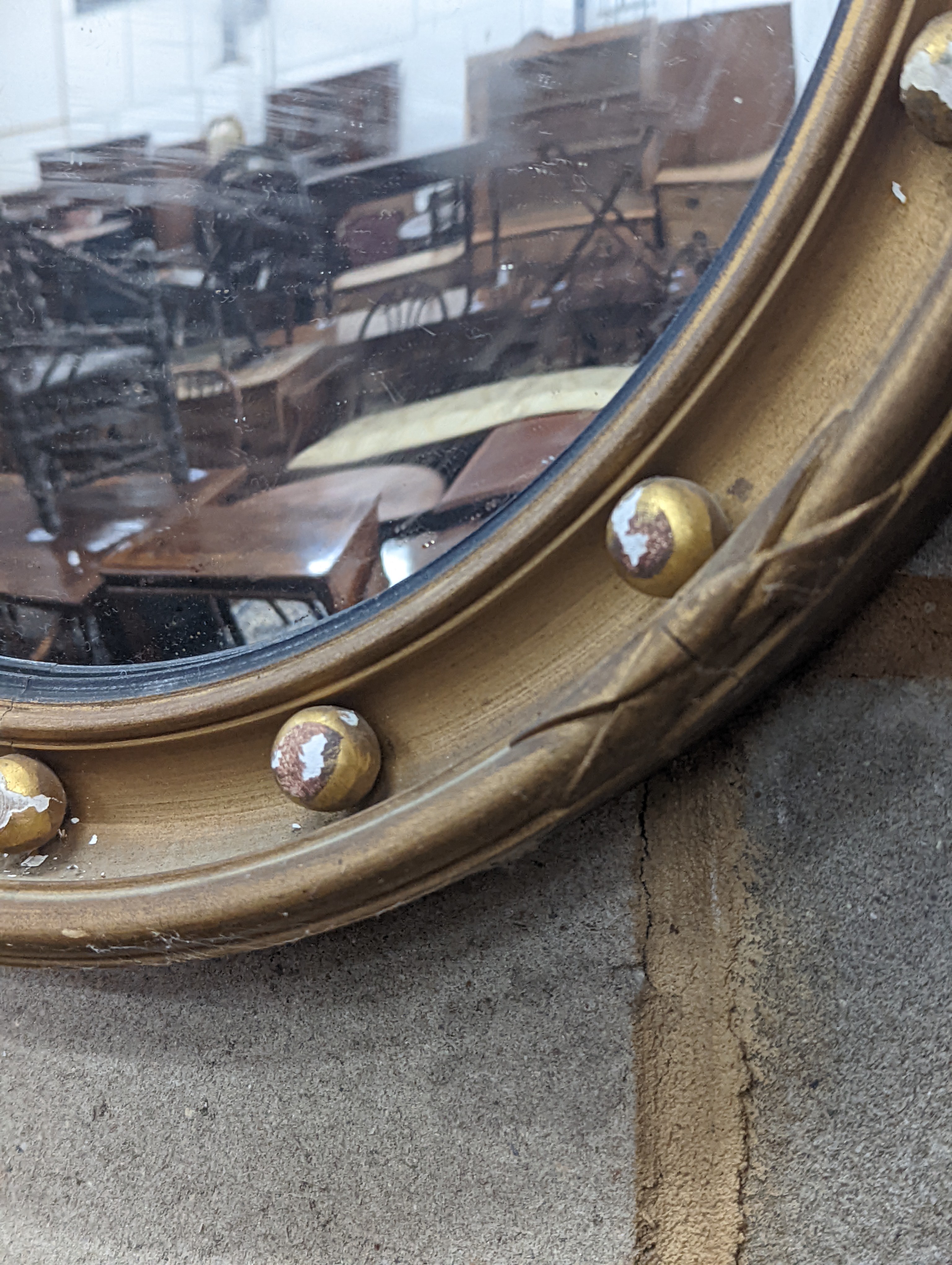 A Regency style circular gilt framed convex wall mirror, diameter 45cm